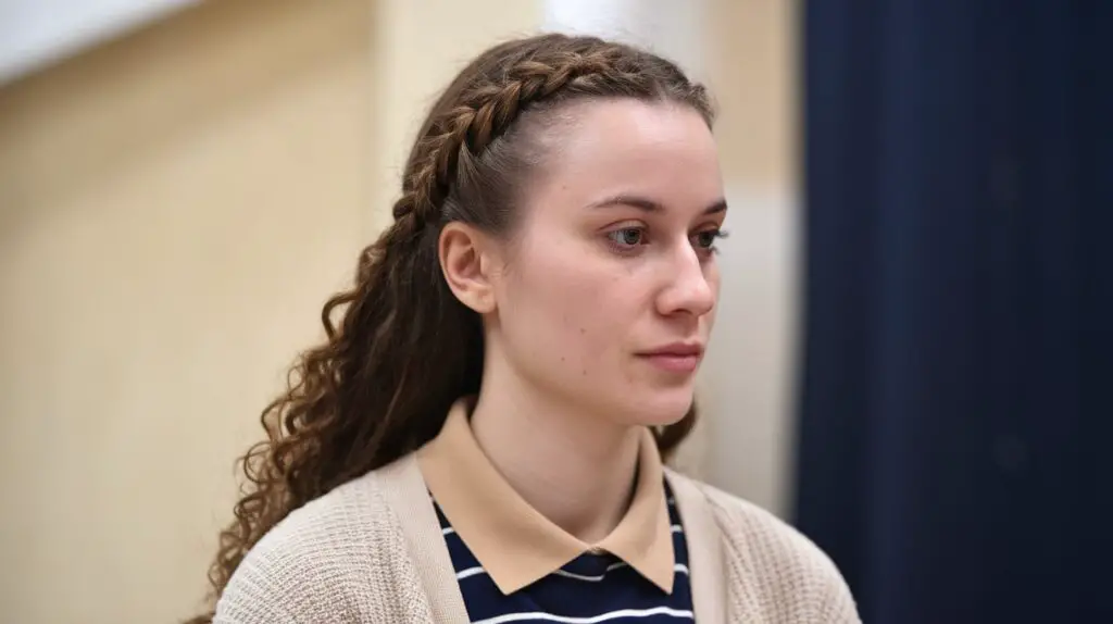 Side profile photo, closeup on Belarusian woman's French Braid on Curly Hair