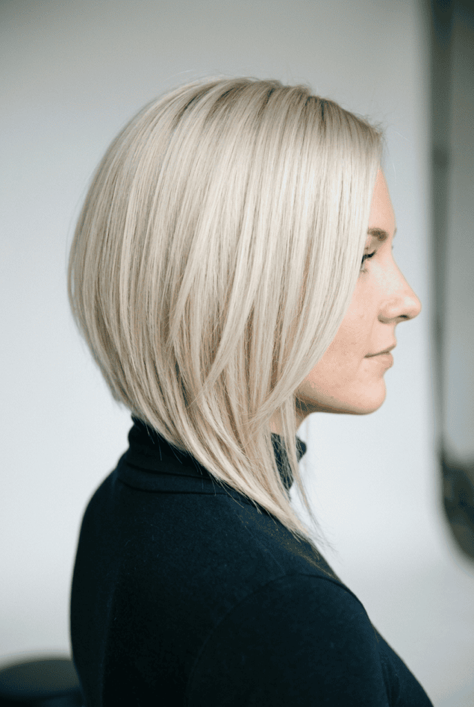 Woman with asymmetrical layered bob one side shorter