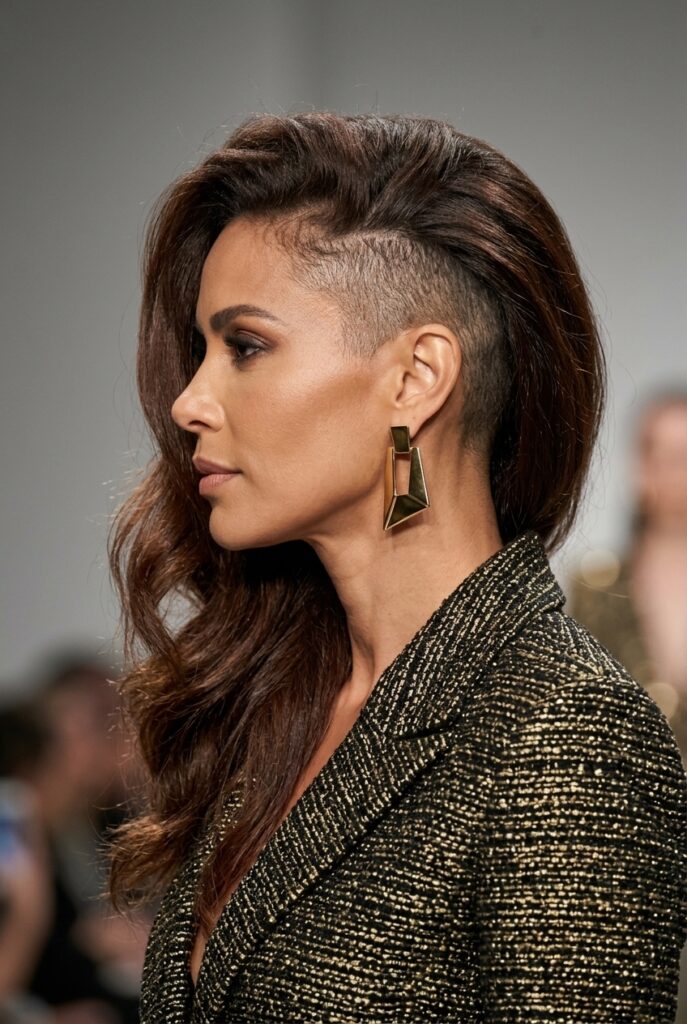 Brazilian fashion parade female model over 40 with a side undercut and long hair