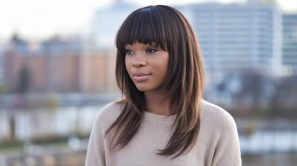 Dark Skin Woman with Brown Long Layered Hair and bangs