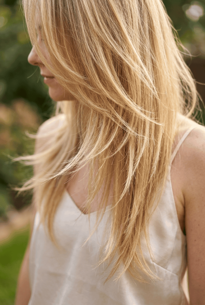 Wispy Feathered Layers Long hair with wispy feathered layers and light texture