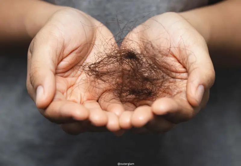 Woman Holding Fallen Hair